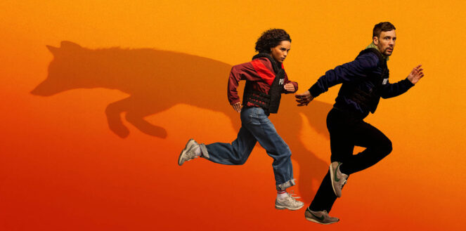 Two people wearing protective vests run across an orange background. Behind them, a large shadow forms the silhouette of a wolf running in the opposite direction.